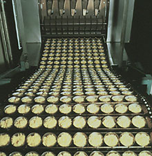 the noodles are cut and placed in cup-sized portions.